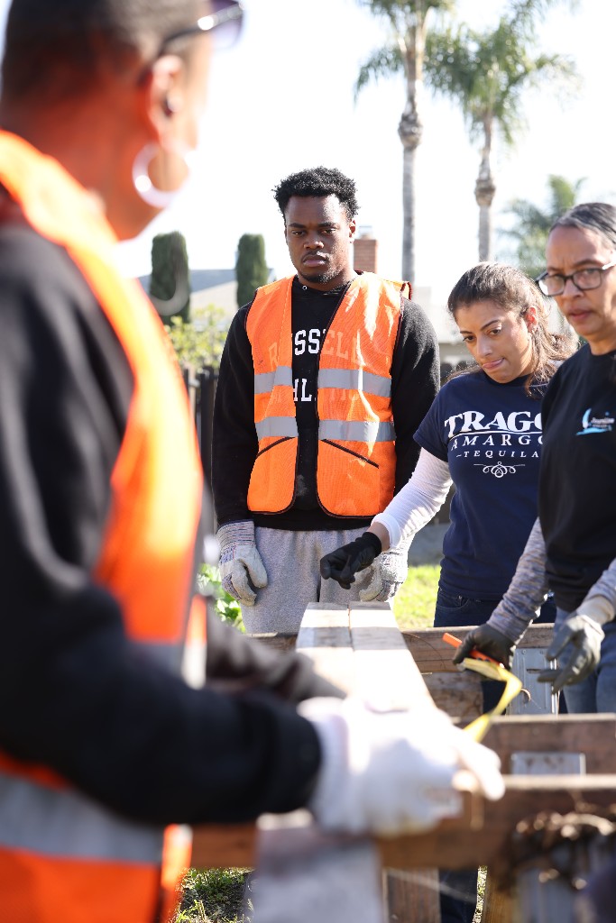 JTM Academy participants working together on a construction project