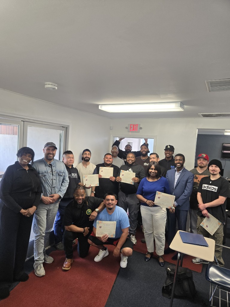 Phase I graduates holding certificates with Career Ready SoCal program staff